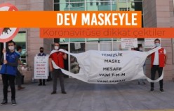 Dev maskeyle koronavirüse dikkat çektiler